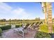 Relaxing pool deck with lounge chairs overlooking the water and scenic landscape at 7673 N Via De Platina Dr, Scottsdale, AZ 85258