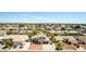 Scenic aerial view of the two-story home, the surrounding neighborhood, and distant mountains at 7749 W Hearn Rd, Peoria, AZ 85381