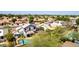 A high angle view of the home's backyard pool, patio, and neighboring houses at 7749 W Hearn Rd, Peoria, AZ 85381