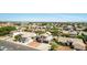 Beautiful aerial view of the two-story home, surrounding neighborhood, and distant mountains at 7749 W Hearn Rd, Peoria, AZ 85381