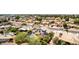 Picturesque aerial view of a residential area with charming houses, mature trees, and inviting pools in a peaceful community at 7749 W Hearn Rd, Peoria, AZ 85381