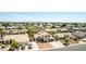 Scenic aerial view of the two-story home, the surrounding neighborhood, and distant mountains at 7749 W Hearn Rd, Peoria, AZ 85381