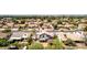 Serene aerial view of a well-maintained neighborhood featuring tidy homes with pools and mature trees in a suburban setting at 7749 W Hearn Rd, Peoria, AZ 85381