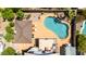 Birds eye view of the rear of the home, the pool, and outdoor seating area at 7749 W Hearn Rd, Peoria, AZ 85381