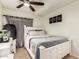 Bright bedroom with a white bed frame, modern décor, and a cozy atmosphere at 7749 W Hearn Rd, Peoria, AZ 85381