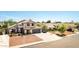 Charming two-story home featuring a well-maintained lawn and inviting curb appeal at 7749 W Hearn Rd, Peoria, AZ 85381
