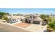 Charming two-story home with well-manicured front yard and attached two-car garage at 7749 W Hearn Rd, Peoria, AZ 85381
