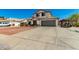 Charming two-story home with a well-manicured front yard, and a two car garage at 7749 W Hearn Rd, Peoria, AZ 85381