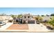 Charming two-story home with well-manicured front yard and attached two-car garage at 7749 W Hearn Rd, Peoria, AZ 85381