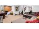 Spacious living room with carpet, a large gray sectional sofa, and a staircase at 7749 W Hearn Rd, Peoria, AZ 85381