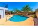 Sparkling pool and backyard area with patio, mature trees, and lush landscaping at 7749 W Hearn Rd, Peoria, AZ 85381