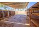 View of the covered backyard patio with concrete flooring and built in shelving at 809 N Gilbert Ave, Casa Grande, AZ 85122