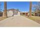 Long driveway leading to a well-maintained home with mature landscaping at 809 N Gilbert Ave, Casa Grande, AZ 85122