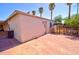 Well-maintained exterior with a brick patio, fencing, and access to an outdoor space at 809 N Gilbert Ave, Casa Grande, AZ 85122