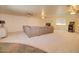 Spacious living room with neutral carpet and a large comfortable couch at 809 N Gilbert Ave, Casa Grande, AZ 85122