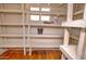 Spacious pantry with built-in shelving, ideal for storage and organization at 809 N Gilbert Ave, Casa Grande, AZ 85122