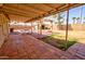 Covered patio area with tiled flooring, perfect for outdoor dining or entertaining, extending living space at 809 N Gilbert Ave, Casa Grande, AZ 85122