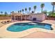 Sparkling pool in a private backyard setting, complete with palm trees and a covered patio area at 809 N Gilbert Ave, Casa Grande, AZ 85122