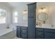 Bathroom featuring double vanity sinks, modern fixtures, and a luxurious tub at 8370 W Audrey Ln, Peoria, AZ 85382
