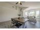 Open-concept dining and living area with stylish decor and plenty of space at 8370 W Audrey Ln, Peoria, AZ 85382