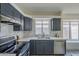 Bright modern kitchen featuring stainless steel appliances and marble countertops at 8370 W Audrey Ln, Peoria, AZ 85382