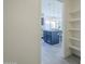 A peek into the blue kitchen with pendant lights at 8370 W Audrey Ln, Peoria, AZ 85382
