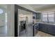 Modern kitchen featuring stainless steel refrigerator and appliances, with white countertops at 8370 W Audrey Ln, Peoria, AZ 85382