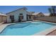 Backyard pool next to home offers a refreshing escape during warm weather at 8370 W Audrey Ln, Peoria, AZ 85382