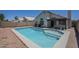 A sparkling pool sits adjacent to the home, offering a relaxing backyard oasis at 8370 W Audrey Ln, Peoria, AZ 85382