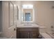 Stylish bathroom showcasing a sleek vanity, LED mirror, and modern fixtures at 866 W Geronimo St, Chandler, AZ 85225
