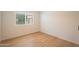 Bright bedroom featuring wood-look flooring and a window providing natural light at 866 W Geronimo St, Chandler, AZ 85225