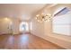 Inviting living room with a chandelier and a large window for ample natural light at 866 W Geronimo St, Chandler, AZ 85225
