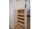 Open pantry doors reveal wood drawers in the kitchen at 866 W Geronimo St, Chandler, AZ 85225