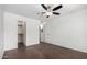 Comfortable bedroom featuring hardwood floors, ceiling fan, and easy closet access at 8787 E Mountain View Rd # 1087, Scottsdale, AZ 85258