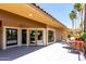 Attractive building exterior with lovely landscaping and covered seating areas at 8787 E Mountain View Rd # 1087, Scottsdale, AZ 85258