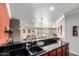 Open concept kitchen with modern sink and breakfast bar overlooking the living area at 8787 E Mountain View Rd # 1087, Scottsdale, AZ 85258