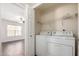 Convenient laundry room with washer, dryer, and shelf perfect for storage at 8787 E Mountain View Rd # 1087, Scottsdale, AZ 85258
