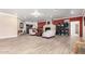 Bright living room boasts a cozy fireplace and open floor plan to kitchen at 8787 E Mountain View Rd # 1087, Scottsdale, AZ 85258