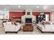 Inviting living room with stylish decor, fireplace, and comfortable seating at 8787 E Mountain View Rd # 1087, Scottsdale, AZ 85258