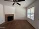 Bright living room featuring hardwood floors and cozy fireplace at 8787 E Mountain View Rd # 1087, Scottsdale, AZ 85258