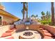 Inviting outdoor grill and lounge area with built-in seating and decorative brickwork, perfect for entertaining guests at 8787 E Mountain View Rd # 1087, Scottsdale, AZ 85258