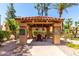Inviting outdoor seating area with a tiled roof and well-manicured landscaping, creating a relaxing ambiance at 8787 E Mountain View Rd # 1087, Scottsdale, AZ 85258