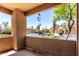 Relaxing patio view showcasing lush landscaping and mature trees at 8787 E Mountain View Rd # 1087, Scottsdale, AZ 85258