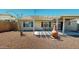 Inviting backyard featuring a pergola-covered patio area perfect for outdoor gatherings and relaxation at 884 W 15Th Ave, Apache Junction, AZ 85120