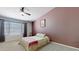 Bright bedroom with soft carpet, a comfortable bed, and ample natural light at 884 W 15Th Ave, Apache Junction, AZ 85120
