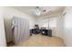 Functional bedroom set up as a home office with desk, chairs, and natural light at 884 W 15Th Ave, Apache Junction, AZ 85120