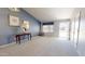 Bright living room with a blue accent wall, comfortable seating, and plenty of natural light at 884 W 15Th Ave, Apache Junction, AZ 85120