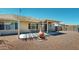 Inviting covered patio with clay chimney, perfect for outdoor relaxation and entertaining at 884 W 15Th Ave, Apache Junction, AZ 85120