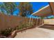 Covered patio and flowering plants enhance the outdoor living space at 927 E Charleston Ave, Phoenix, AZ 85022