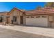 Charming front exterior with a two-car garage and well-maintained landscaping at 927 E Charleston Ave, Phoenix, AZ 85022